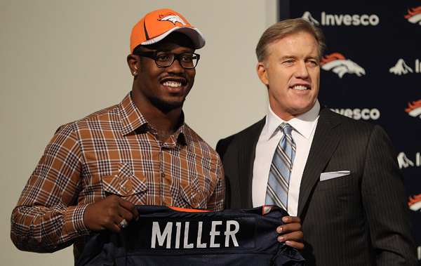 Von Miller and John Elway in happier times, when Miller was drafted in 2011. (Justin Edmonds/Getty Images)